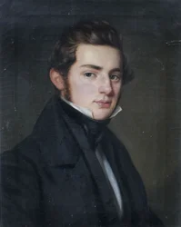 Portret van een jonge heer in zwarte jas in driekwartaanzicht naar rechts